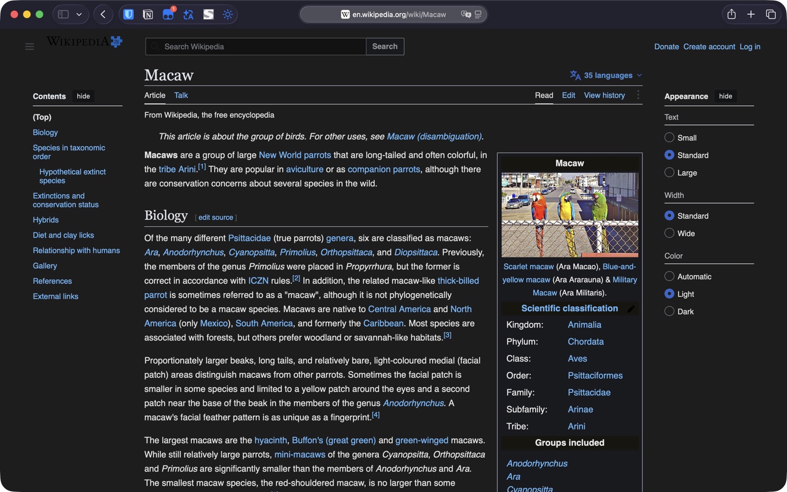 A dark Safari page with colorful macaw photos not color-inverted